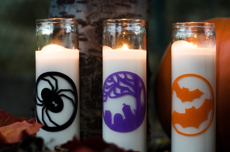 three tall Halloween candles