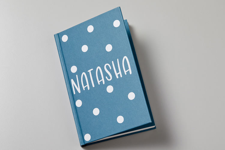 Blue notebook with personalized vinyl stickers for Natasha