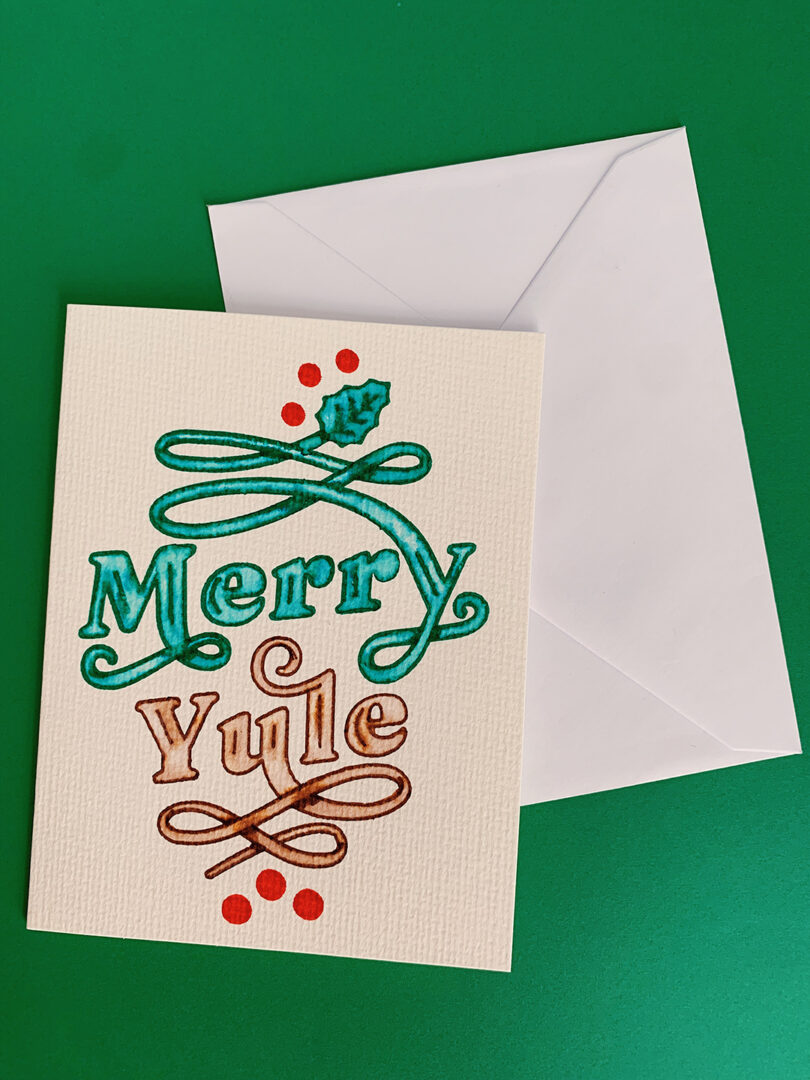 merry yule watercolor design on card