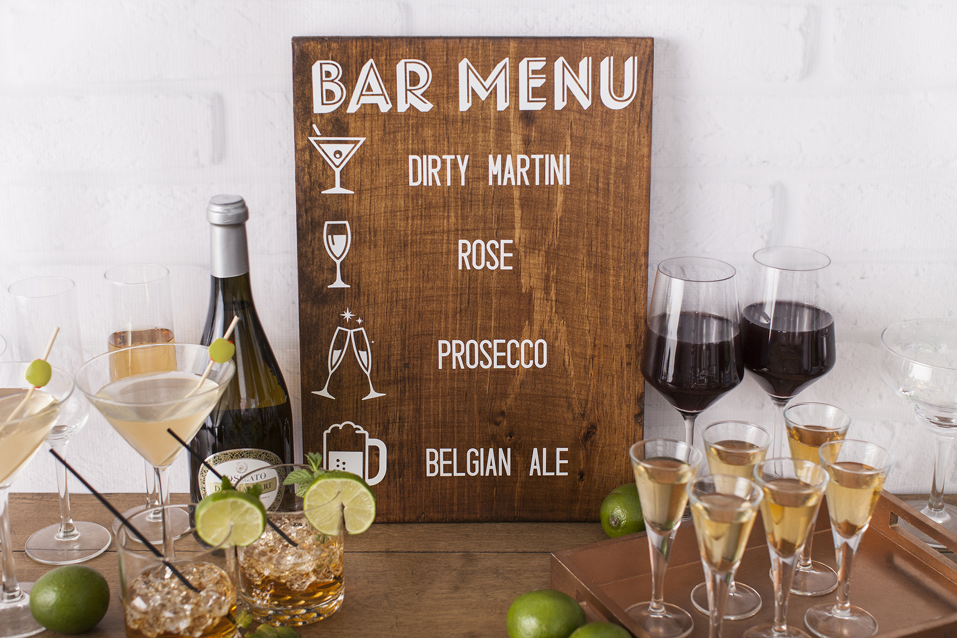 Bar menu on wood with icons next to each drink name