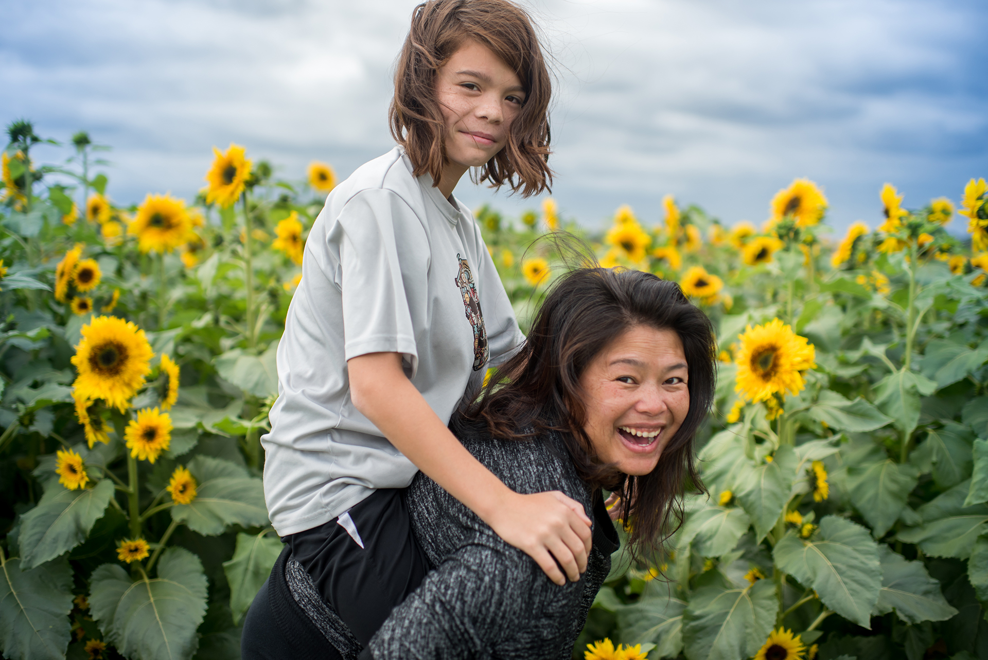 CAP Artist Jennifer Starr and son Ben in sunflower field