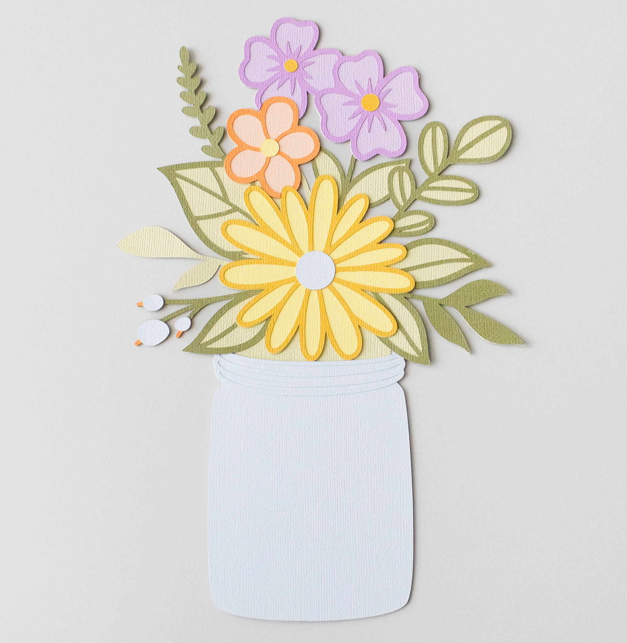 Gift card holder with bouquet of wild flowers in a jar. 