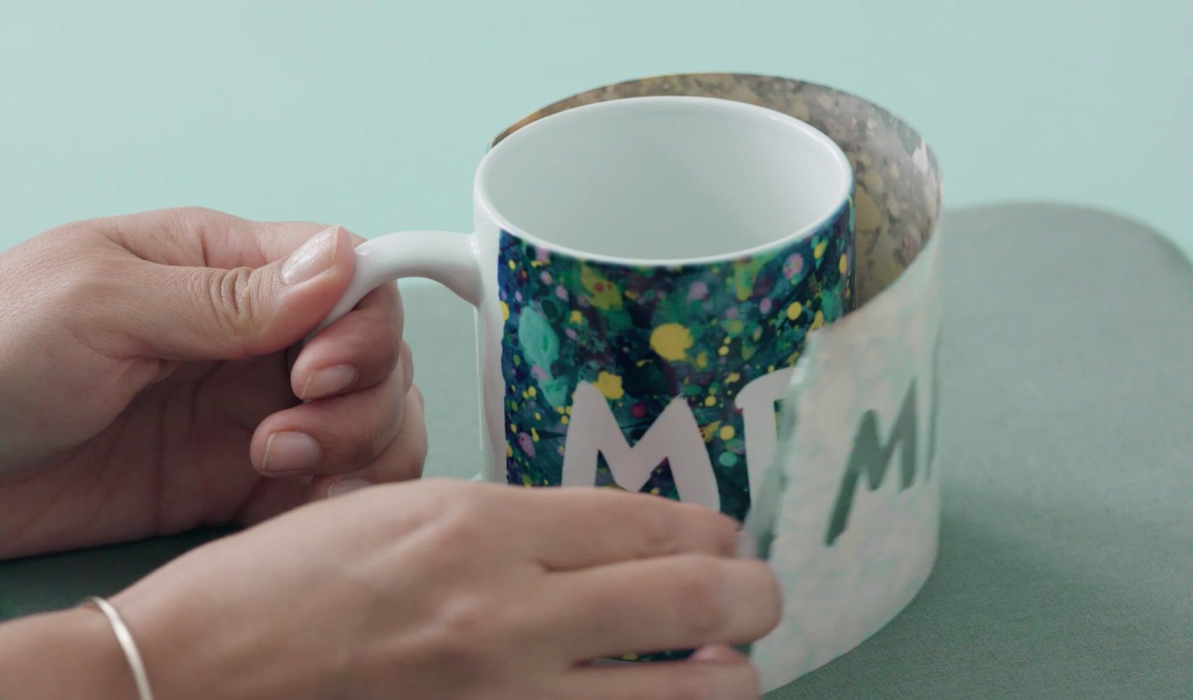 Infusible Ink being removed from mug.