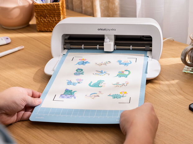 Cricut Explore 3 smart cutting machine cutting blue vinyl