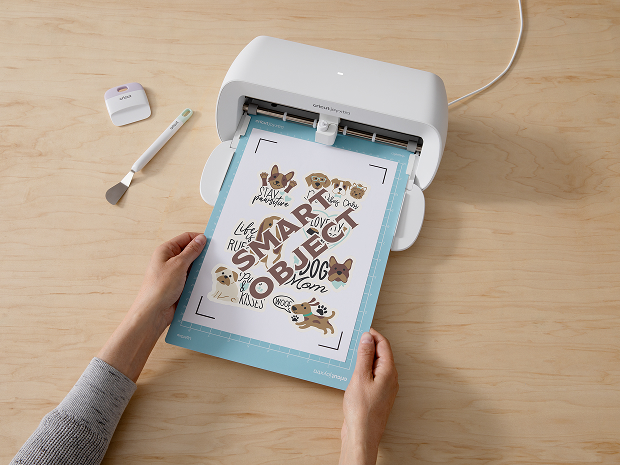 Cricut Explore 3 smart cutting machine cutting blue vinyl